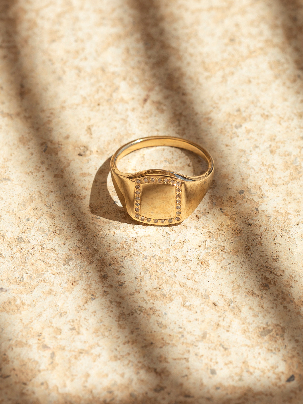 modern emblem ring w/ diamonds